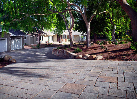 large paver driveway sloped downhill