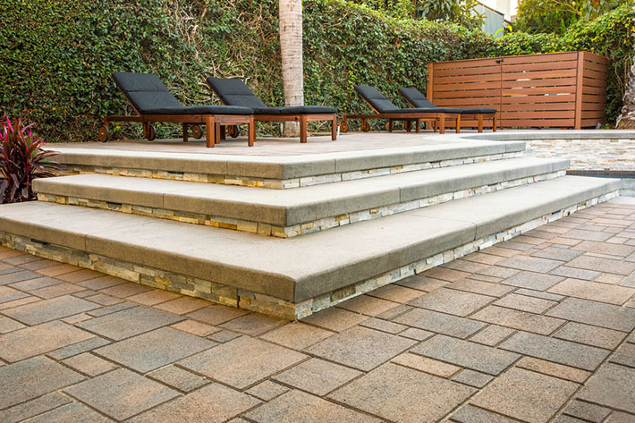 paver step on patio with recliing chairs