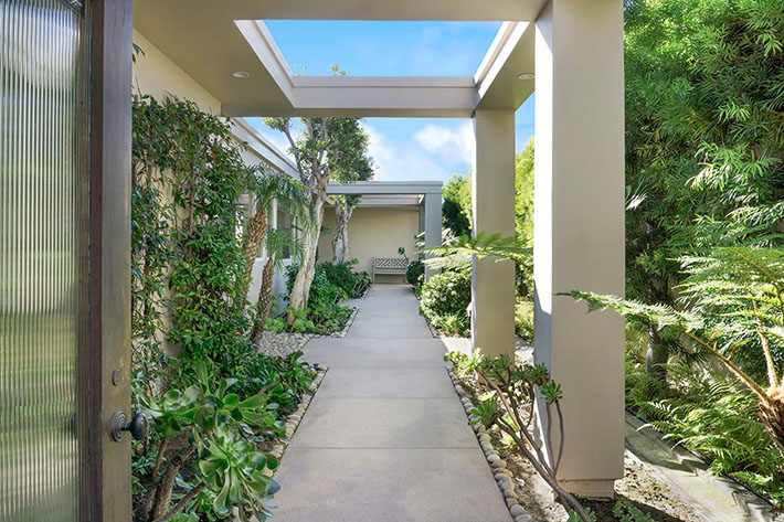 large paver slabs in lush backyard